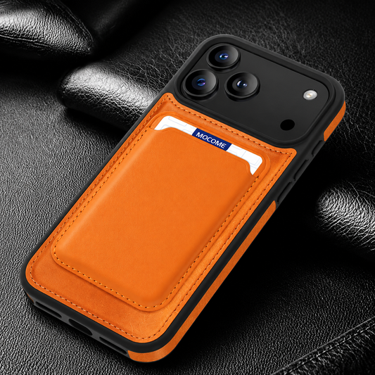 An orange-backed case lies on black textured fabric, with a matching stitched card pocket holding a partly visible white-and-blue card.