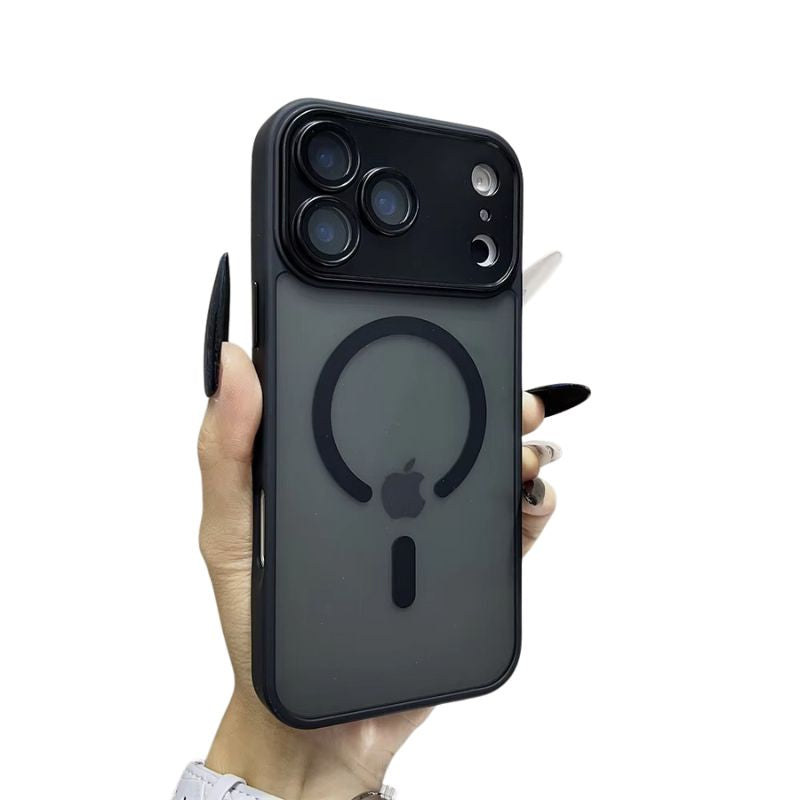 A hand with long black and white nails holds a smoky gray frosted phone case against white. A black open circular ring surrounds the visible Apple logo beneath a broad black camera panel.