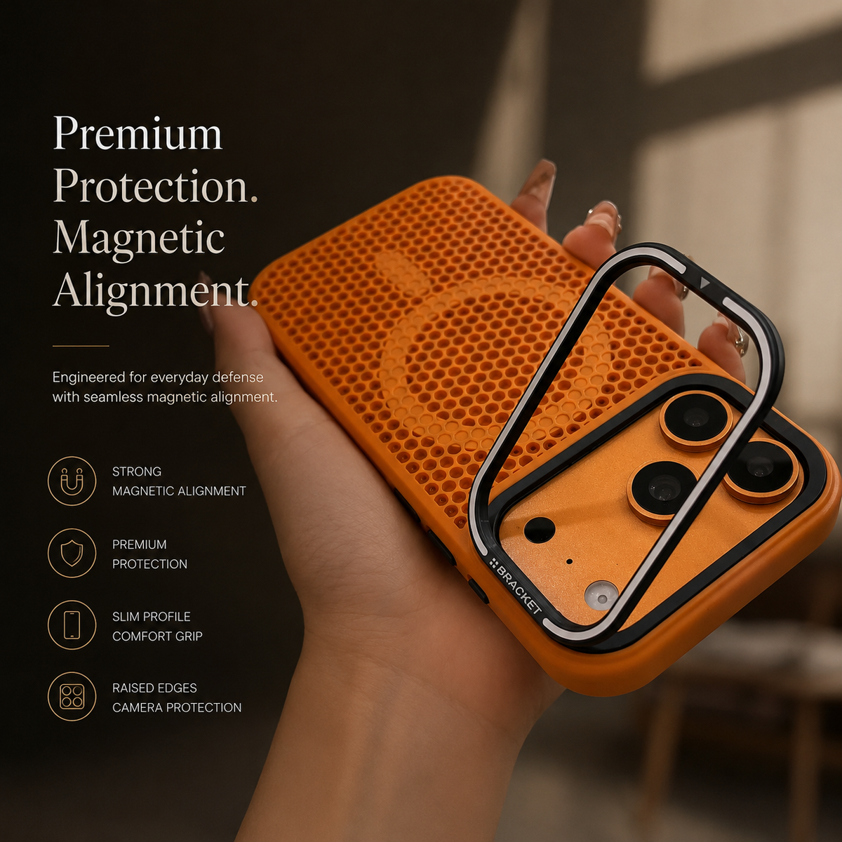 A hand holds an orange perforated case with its rectangular camera-frame stand raised away from the lenses. Text advertises magnetic alignment, protection and raised edges.