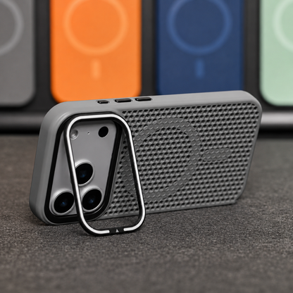 A gray perforated phone case stands horizontally on its rectangular camera-frame stand, showing a matching circular rear ring amid the mesh-like holes.