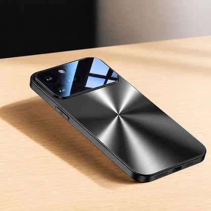 A dark metallic-looking case lies on a wooden table in sunlight, showing a radial brushed rear pattern, reflective camera panel and bottom charging opening.