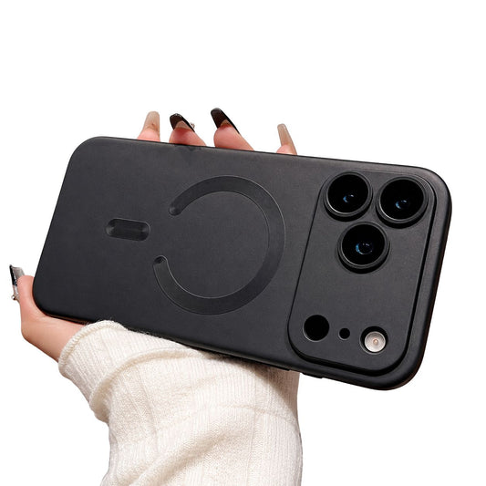 A hand holds a charcoal matte-looking phone case horizontally against white, with a broad camera guard and matching horseshoe-shaped ring and short bar.
