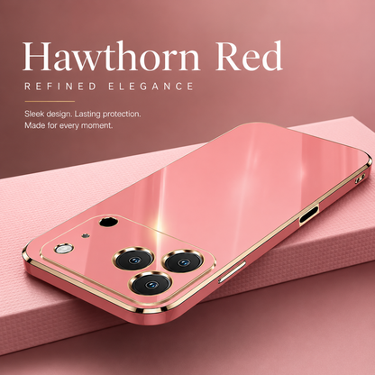 Pink reflective phone case lying diagonally on pink fabric, with gold-colored edging and individual camera outlines. The graphic names the color 'Hawthorn Red'.