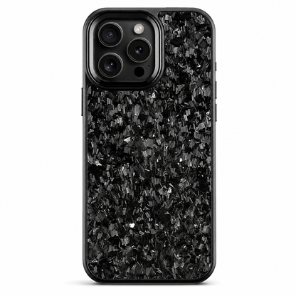 A black phone case stands upright on white. Irregular gray flecks are scattered through a dark mottled pattern across the back. A smooth rounded black camera surround encloses three lenses, flash and sensor, and a narrow black rim outlines the case.