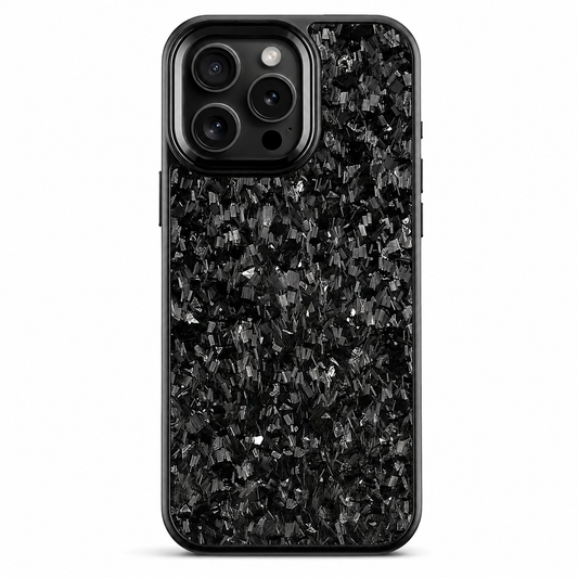 A black phone case stands upright on white. Irregular gray flecks are scattered through a dark mottled pattern across the back. A smooth rounded black camera surround encloses three lenses, flash and sensor, and a narrow black rim outlines the case.