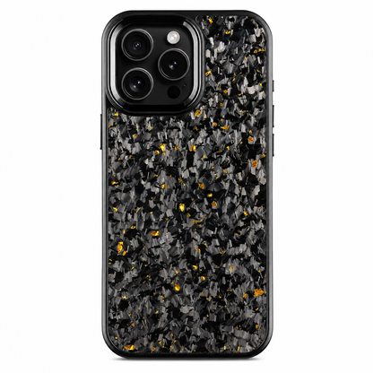 A black phone stands upright against a white background, showing a mottled gray-and-black case with scattered yellow flecks. A raised rectangular camera surround with a silver-colored edge frames three rear lenses at the upper left. The case has smooth rounded black borders and an otherwise uninterrupted patterned back.