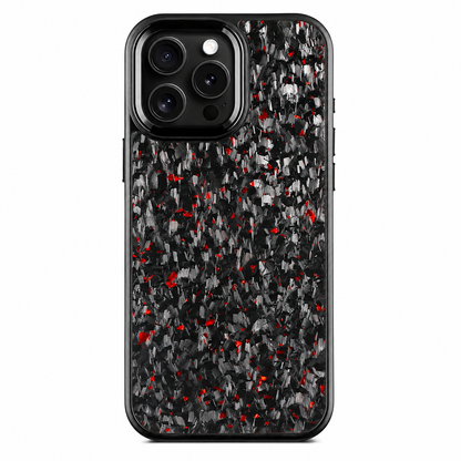 A black phone case stands upright against a white background. Irregular gray-and-black fragments and small red flecks cover the back inside a rounded black border. Three rear lenses sit within a raised black rectangular surround with a narrow silver-colored edge at the upper left.