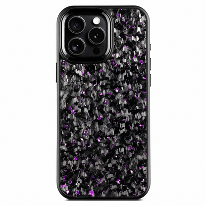 A black phone stands upright on a white background with its rear facing forward. The case has a fragmented gray-and-black pattern dotted with purple flecks. Three camera lenses sit within a raised black surround edged in silver color at the upper left, above the smoothly rounded outer border.