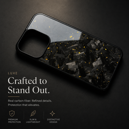 A black case with gray fragments and gold flecks lies diagonally on a dark surface. Light reflects across its glossy back beneath text reading Crafted to Stand Out.