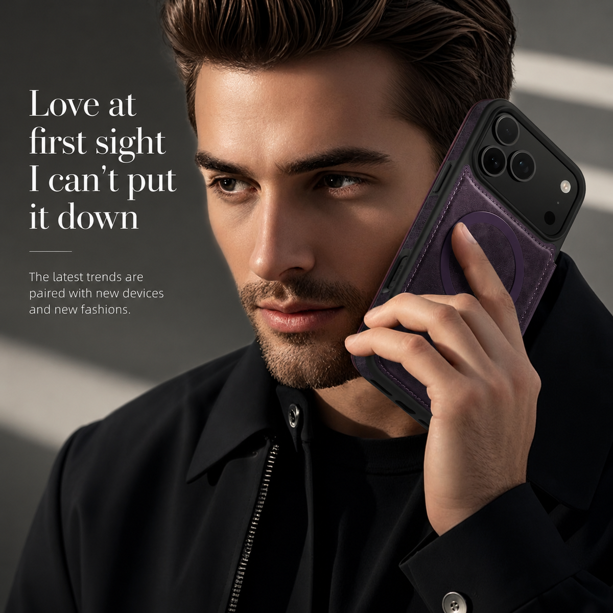 A person with dark swept-back hair and a black jacket holds a purple-cased phone to their ear. The stitched back and magnetic ring face the viewer.