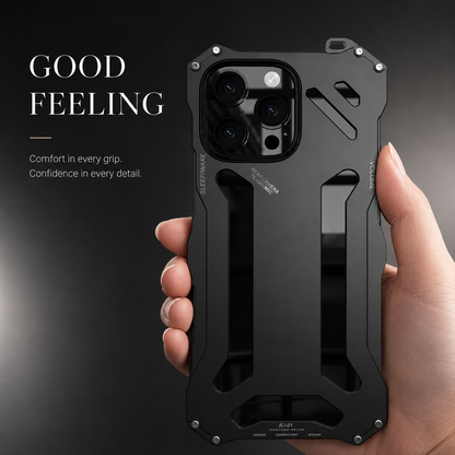 A hand holds a black geometric case upright against dark gray beneath Good Feeling.