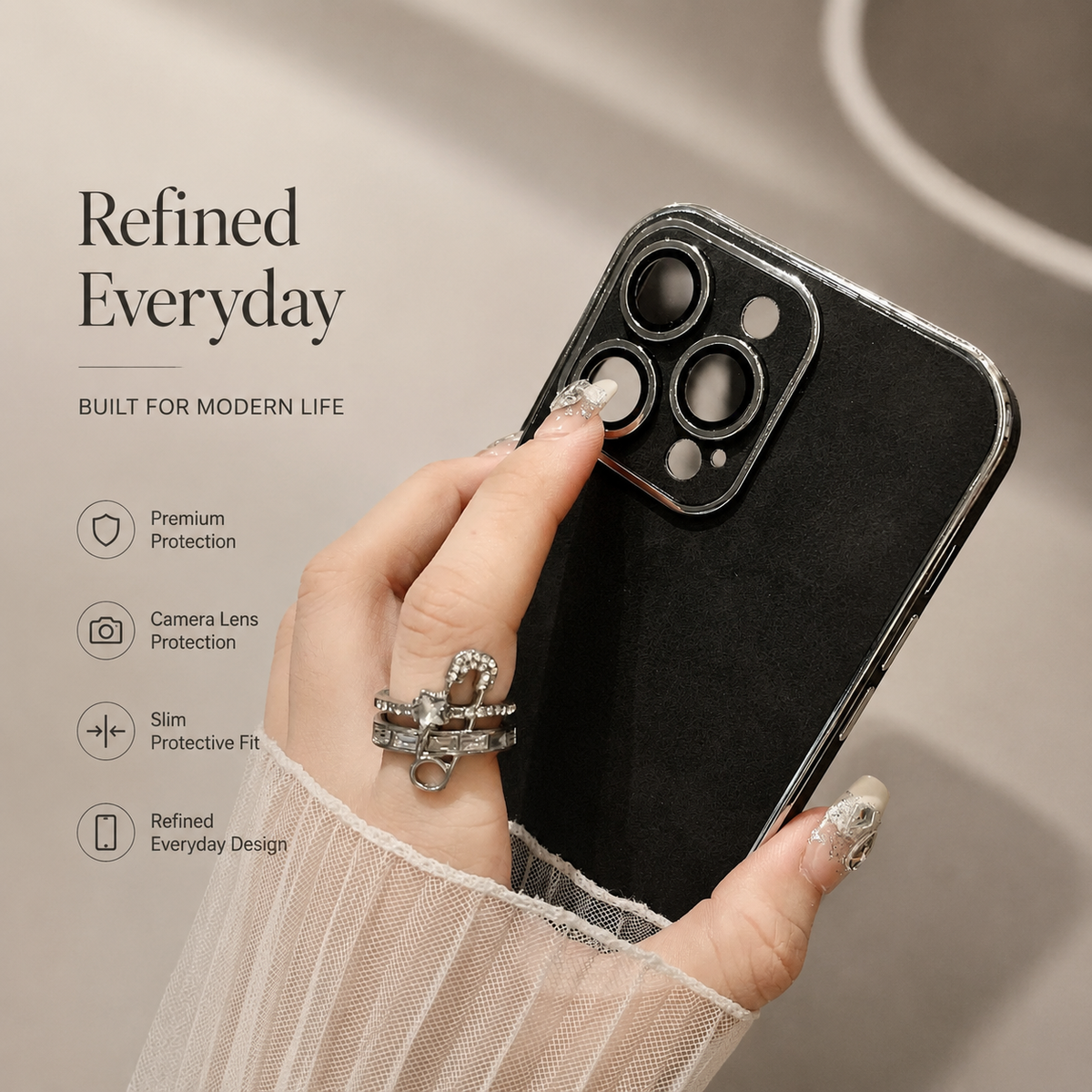 Hand holds a black suede-look case at an angle, with a finger touching one camera opening. Silver-colored outlines frame the camera panel and case edge.