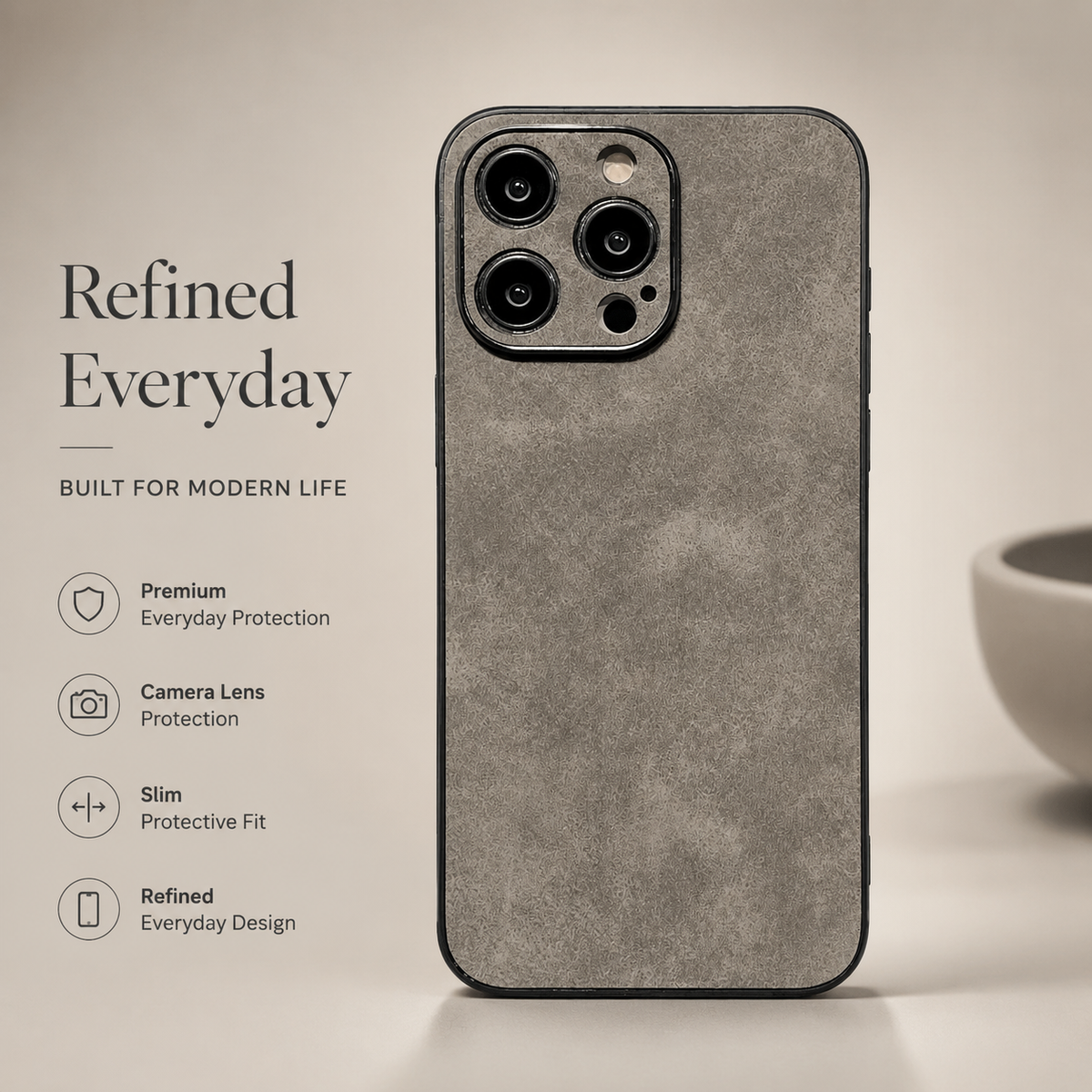Gray suede-look case stands upright on beige, showing a mottled back and individually framed camera openings. Text highlights camera protection and a slim fit.