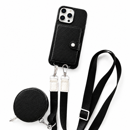 A black textured wallet phone case, matching round zippered pouch, and long black strap are arranged on a white background. A stitched rectangular card flap with a silver-colored snap covers the case's back. Two metal clips connect the strap ends to loops along the phone's lower edge, and an adjustment buckle sits on the strap.