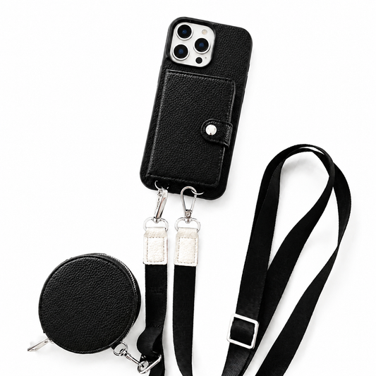 A black textured wallet phone case, matching round zippered pouch, and long black strap are arranged on a white background. A stitched rectangular card flap with a silver-colored snap covers the case's back. Two metal clips connect the strap ends to loops along the phone's lower edge, and an adjustment buckle sits on the strap.