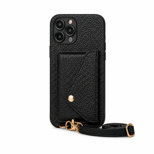 Black pebbled leather-look phone case standing upright with a stitched envelope-shaped wallet flap, gold-colored snap and two strap rings. A matching adjustable strap lies coiled beside it.
