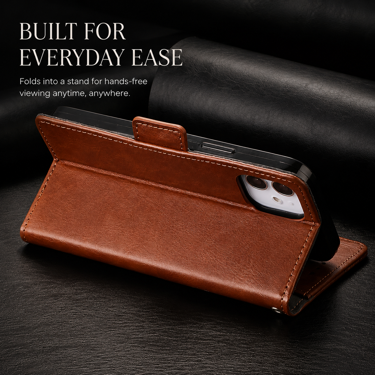 A brown wallet supports a phone horizontally on its folded cover. The rear camera faces forward above the stitched flap. Text reads Built for Everyday Ease.