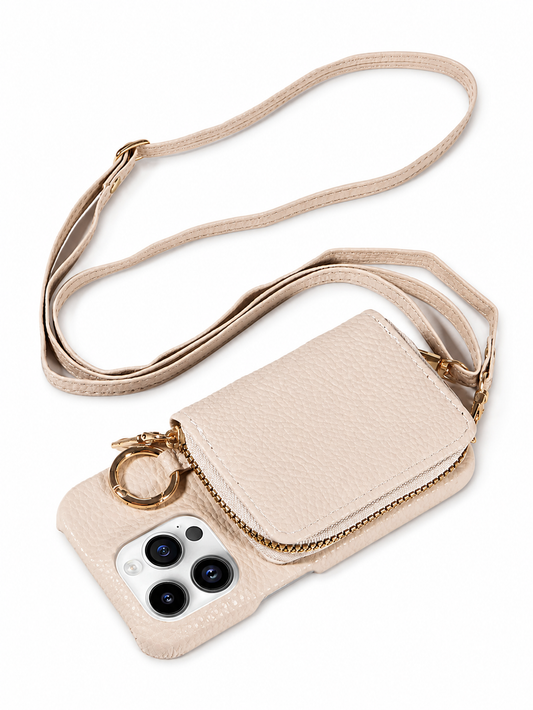 A cream pebbled leather-look phone case lies beside its matching long strap on white. The raised back wallet has a gold-colored zipper, with a circular ring beside the camera opening.