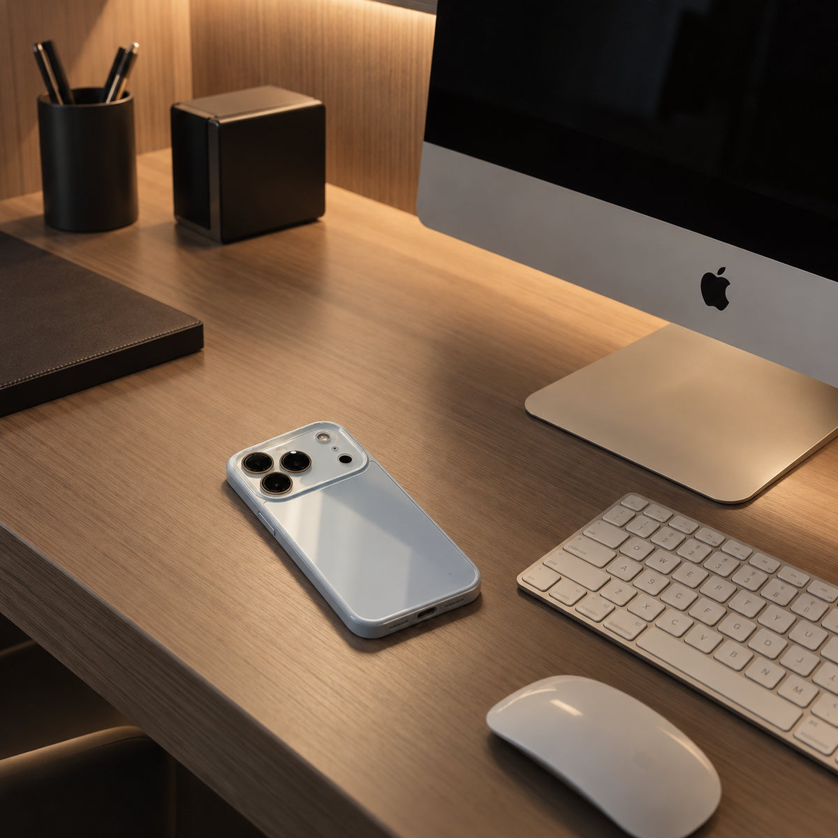 Image showing premiumi Mac Workspacewith Blue Smartphone, featuring iphone slim shockproof case with tempered glass back & camera protection.