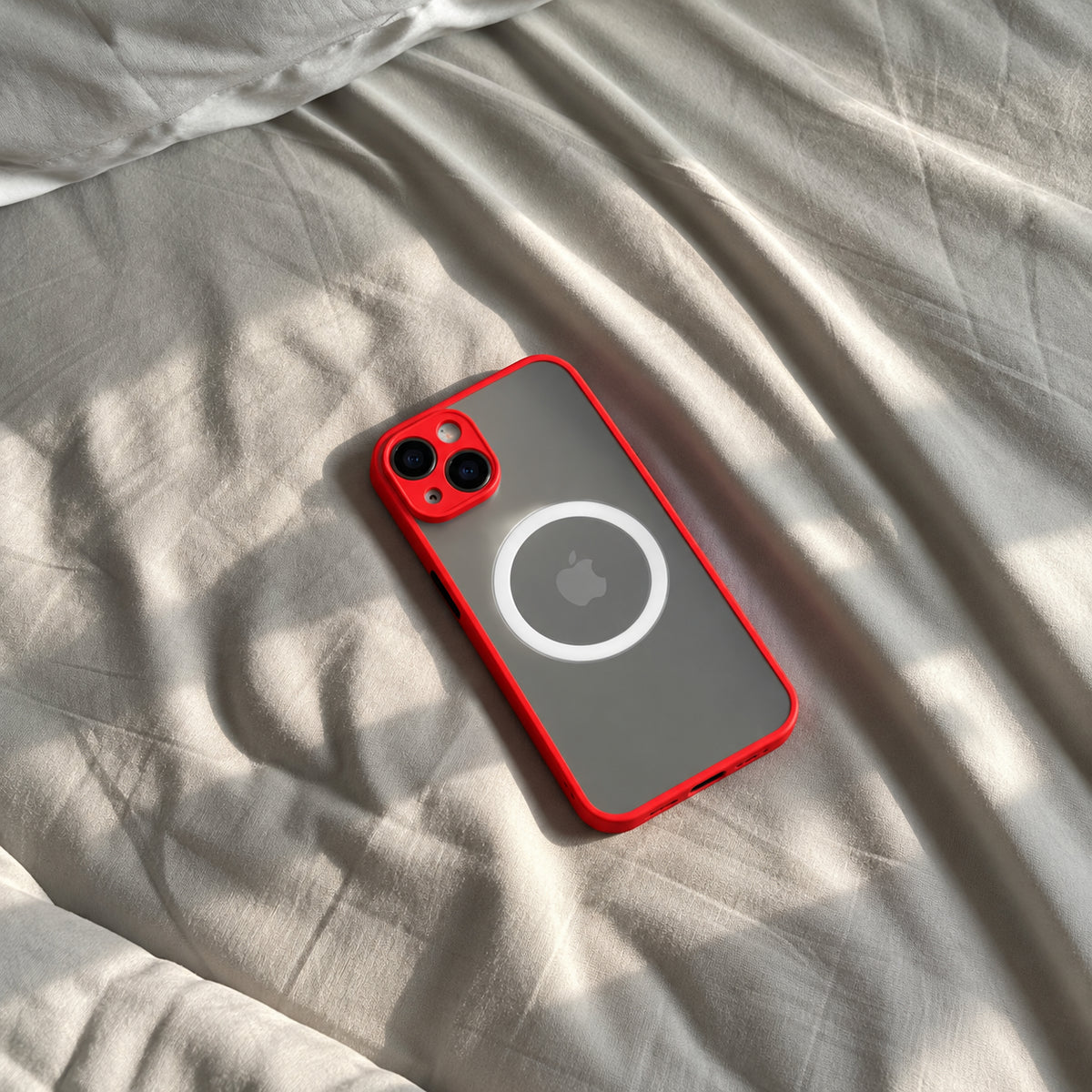 Image showing red Cased Phone on Sunlit Linen, featuring iphone hard matte magsafe case with anti-fingerprint finish & slim protection.