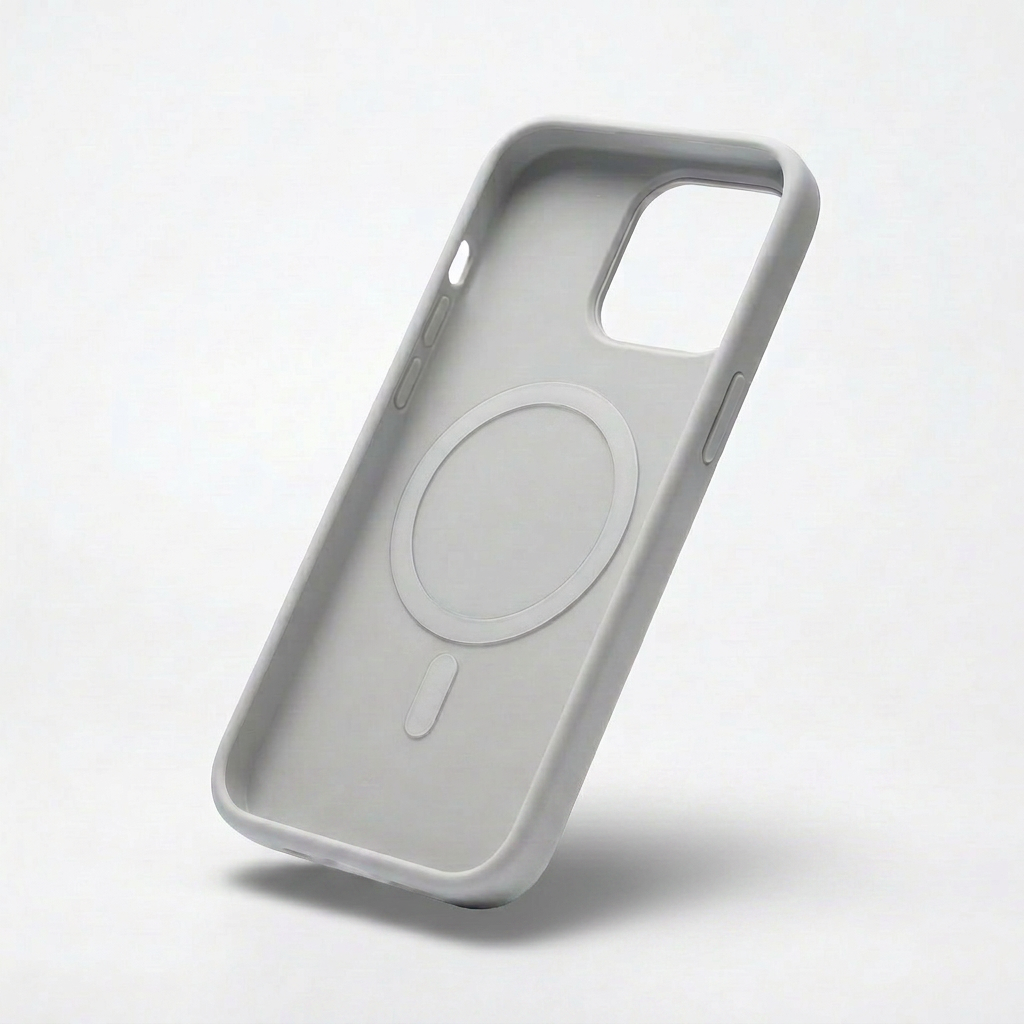 Interior of a light gray phone case shown at an angle, revealing a recessed circular ring and short bar, camera opening and molded side buttons.