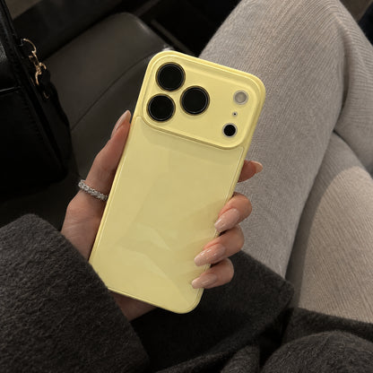 Image showing soft Yellow Phone in Hand, featuring iphone slim shockproof case with tempered glass back & camera protection.