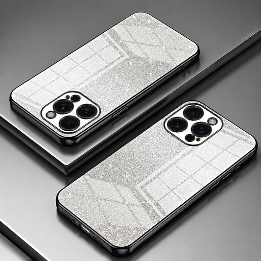 Two phones in glitter-covered cases lie diagonally with their backs facing upward on stepped display platforms. The cases are silver with black edges, with sparkling surfaces crossed by fine rectangular lines and broad angled bands. Shiny borders outline the sides and individual camera openings.